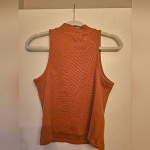 Sleeveless, turtleneck blouse